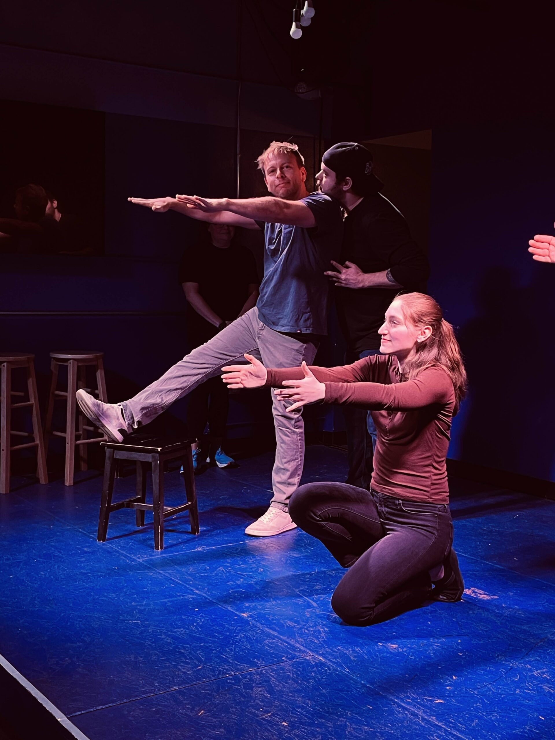 Improv students performing a Harold long-form scene on stage at the Neighborhood Comedy Theatre in downtown Mesa